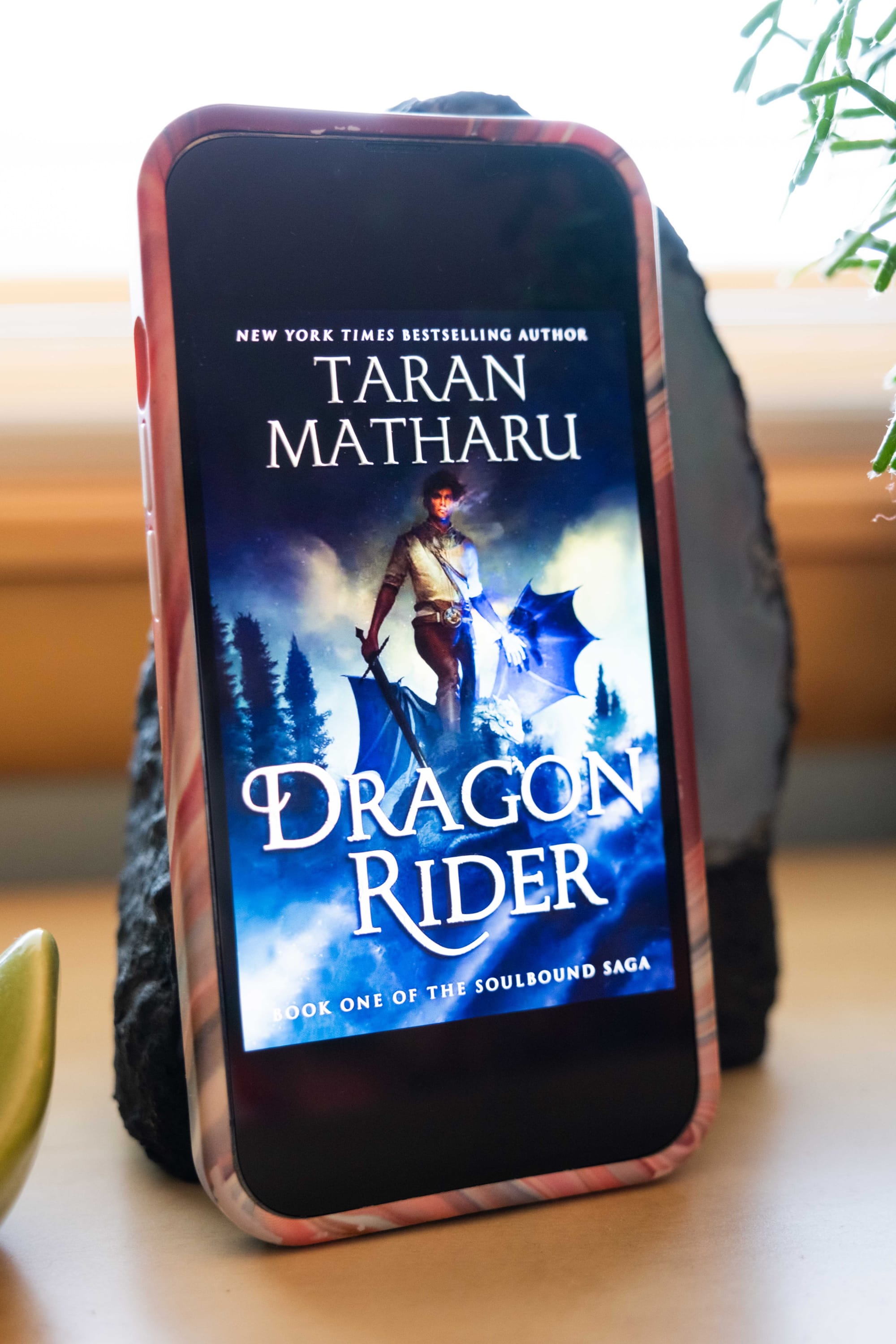 Book cover for Dragon Rider by Taran Matharu on an iPhone