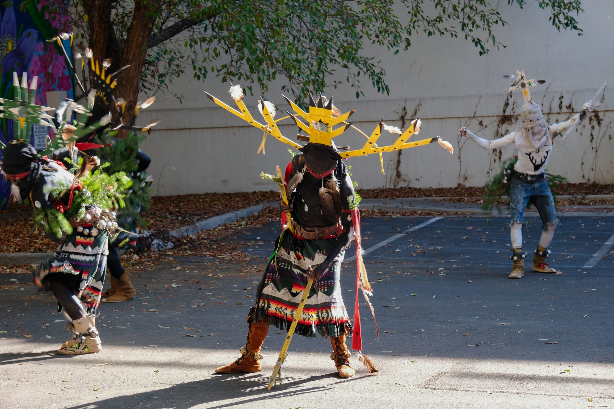 Dishchii' Bikoh Apache Crowndancers dressed in traditional attire dance together