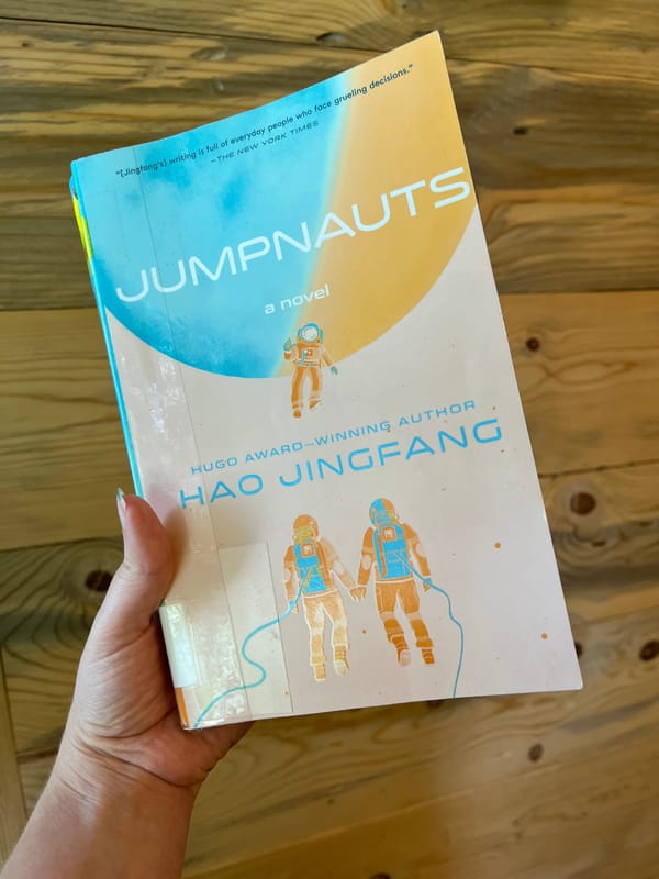 hand holding the book Jumpnauts by Hao Jingfang